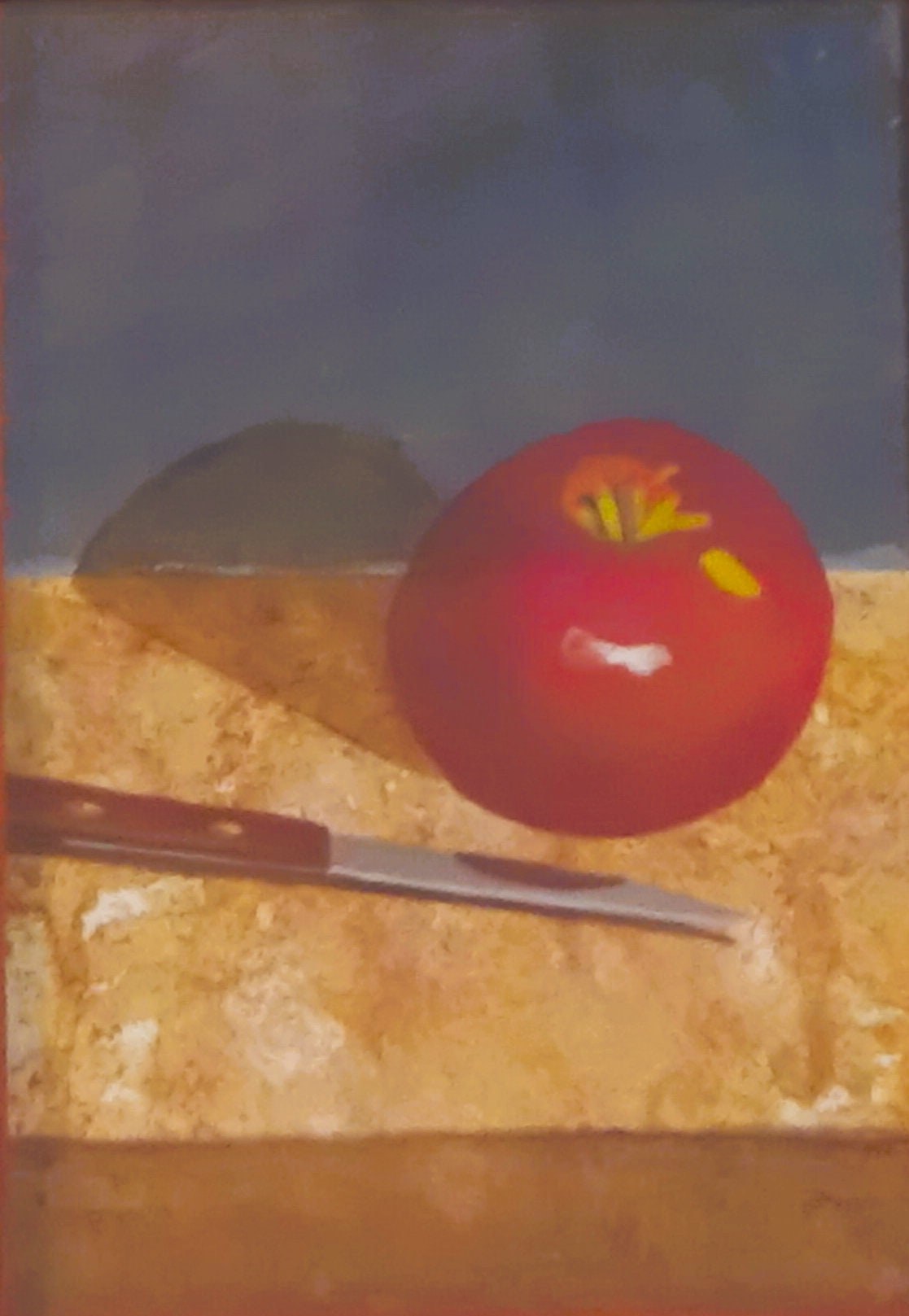 Bright Red Apple and Knife on table.