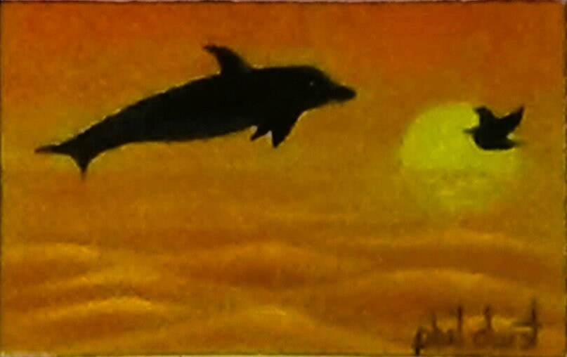 Diving dolphin at Siesta Key Sunset., view 2