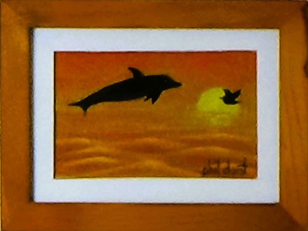 Diving dolphin at Siesta Key Sunset., view 3