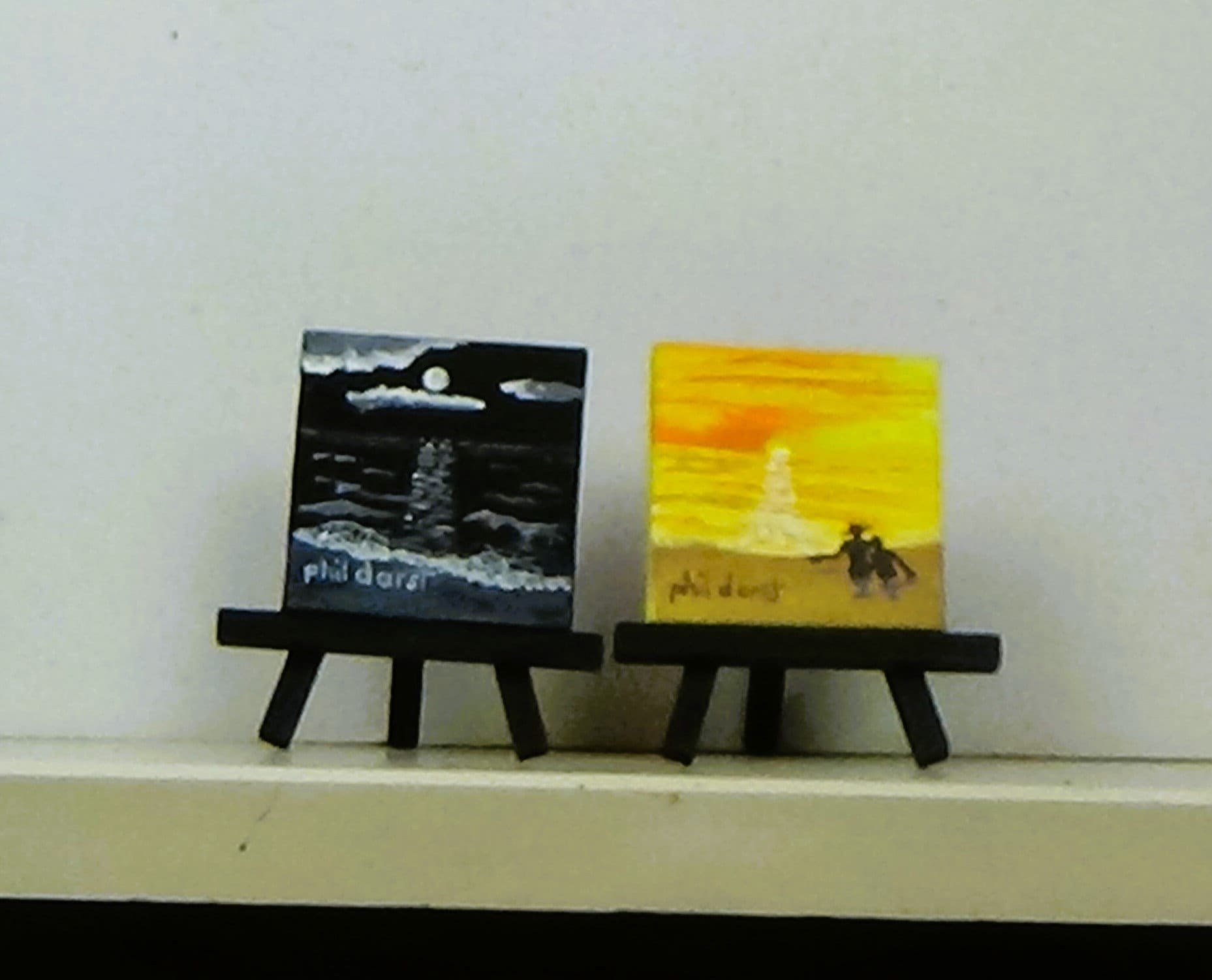 Setting sun and moonlight on ocean miniature set of two. Easel not included