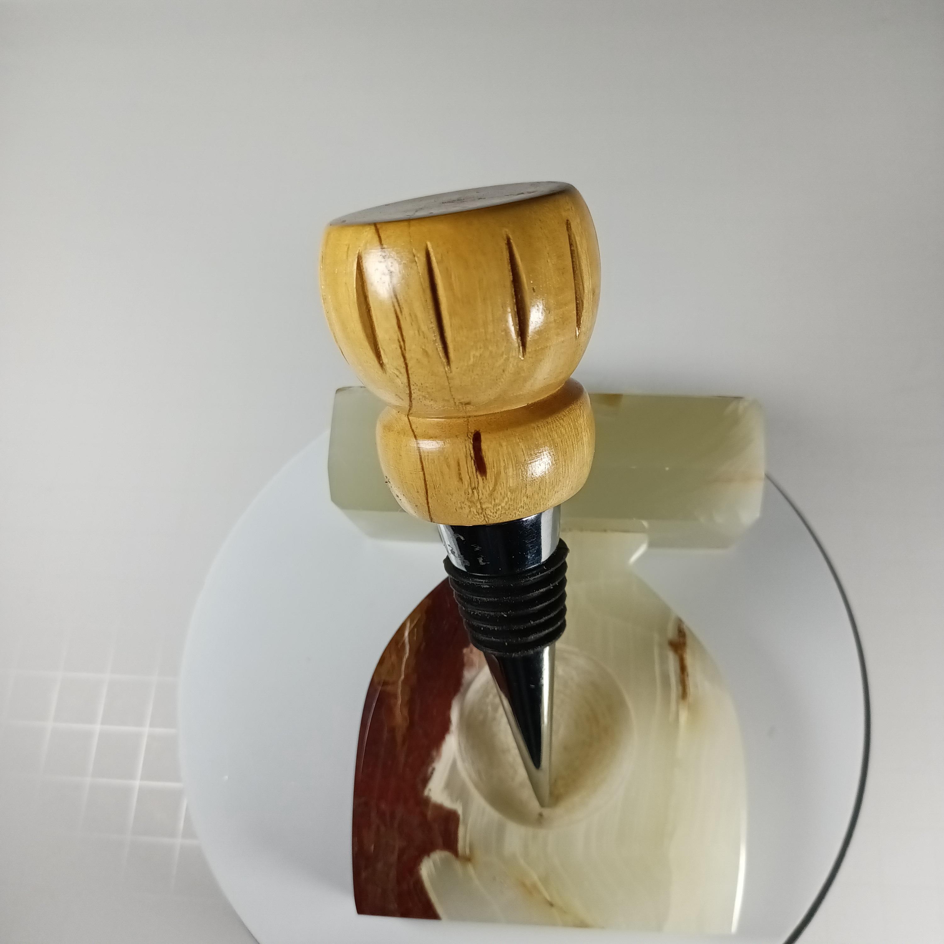 Handmade hard maple bottle stopper with a pale turned wood top