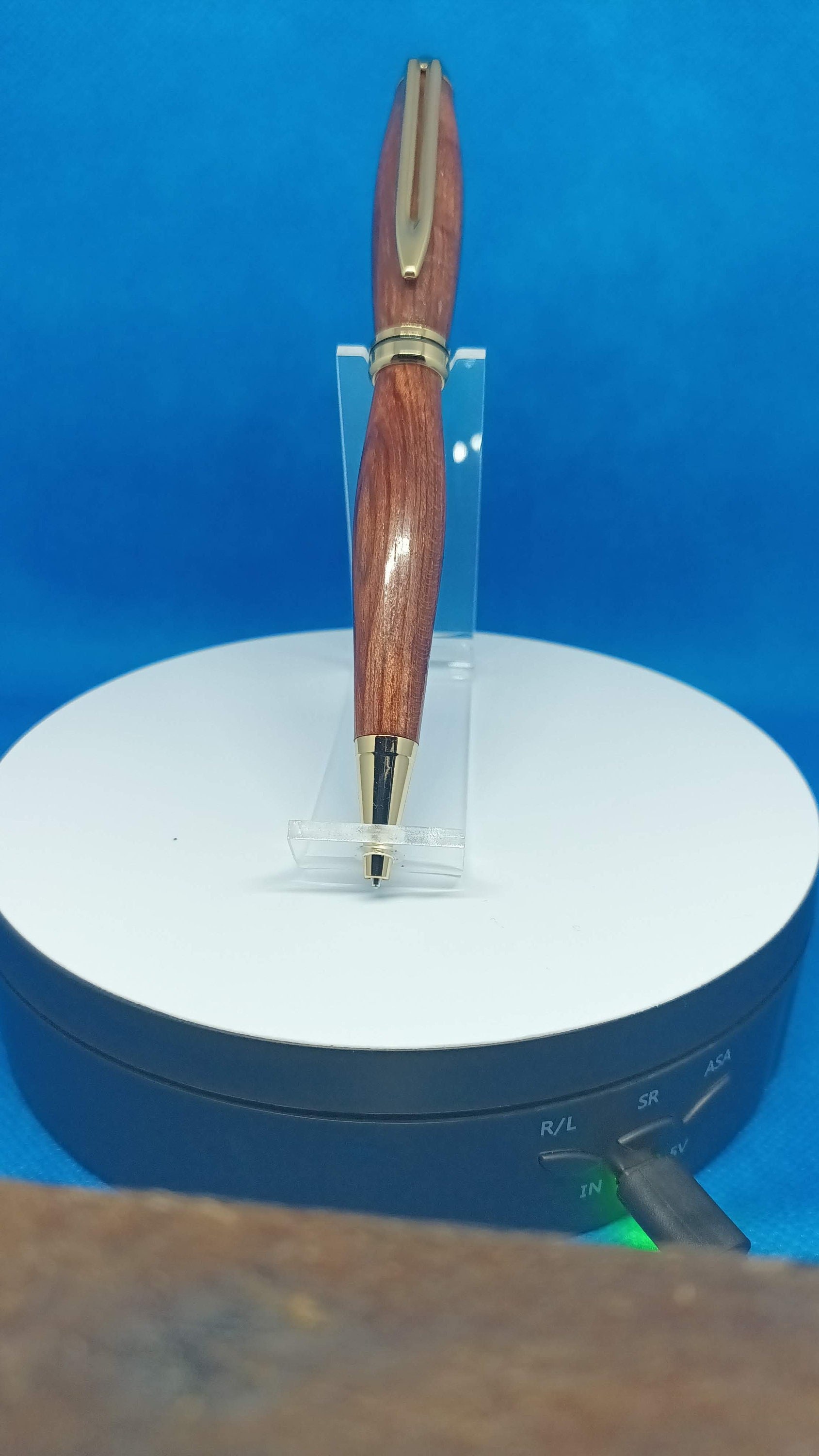 Handmade Bolivian rosewood twist pen with gold accents