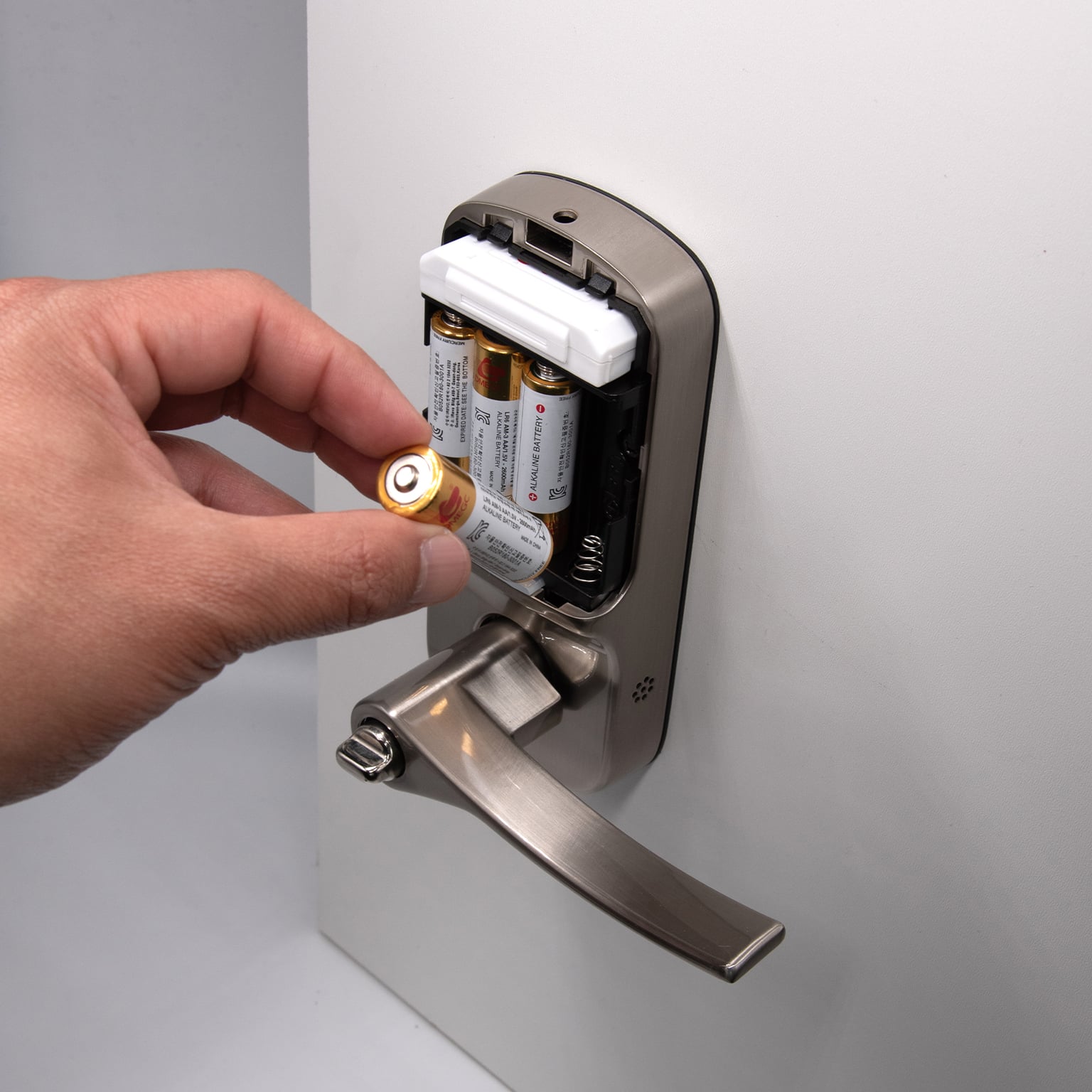 Replacing batteries in the interior compartment of a smart door lock