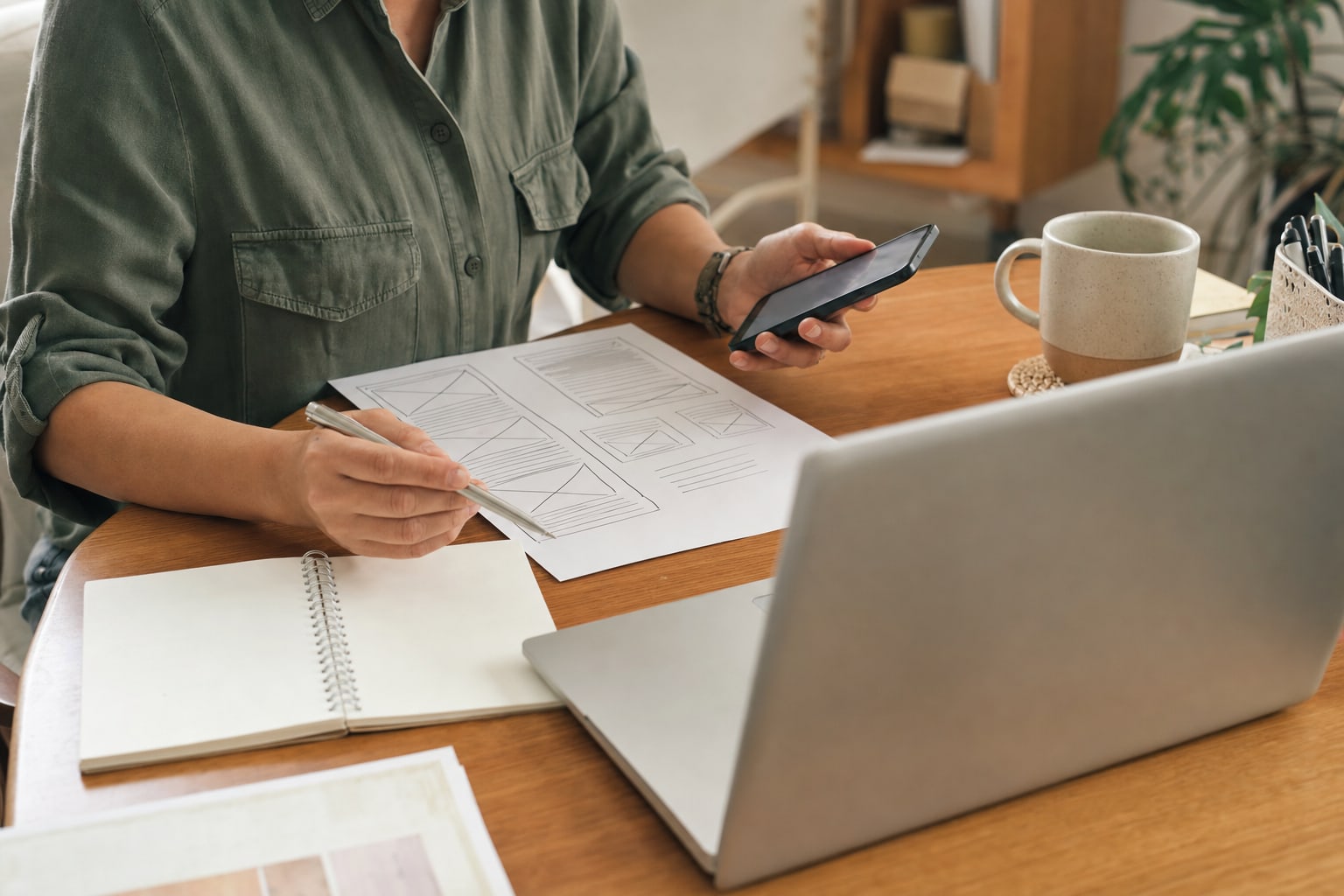 Small business owner planning a customer newsletter at a desk