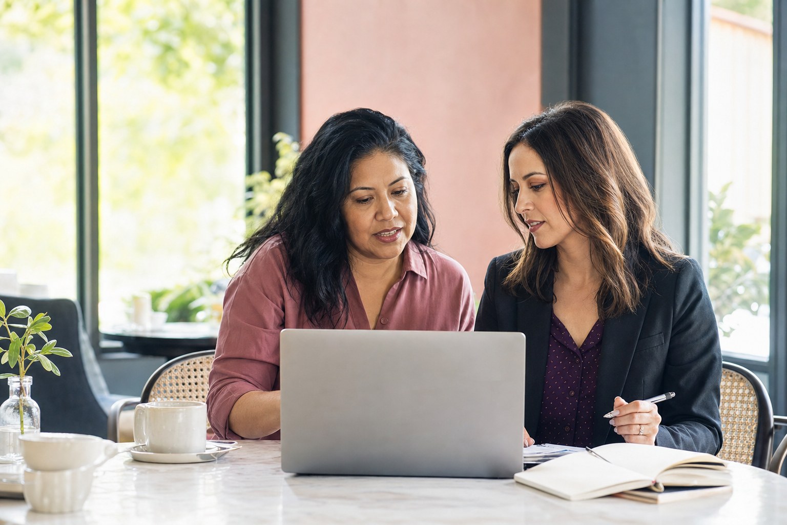 Business owner and marketing consultant reviewing a plan together