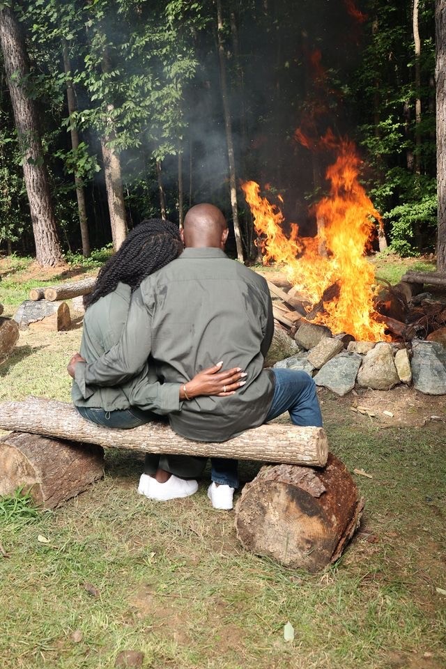 Bruce and Kasey Louis together around a fire
