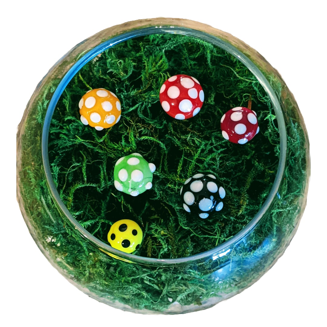 Glass bowl with colorful mushroom-shaped glass pieces
