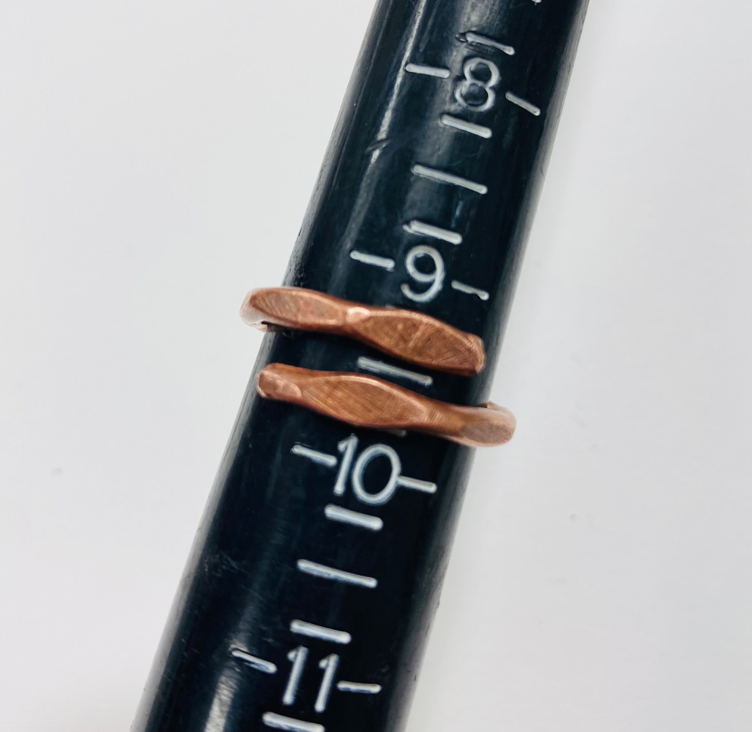Raw copper ring shown from the side