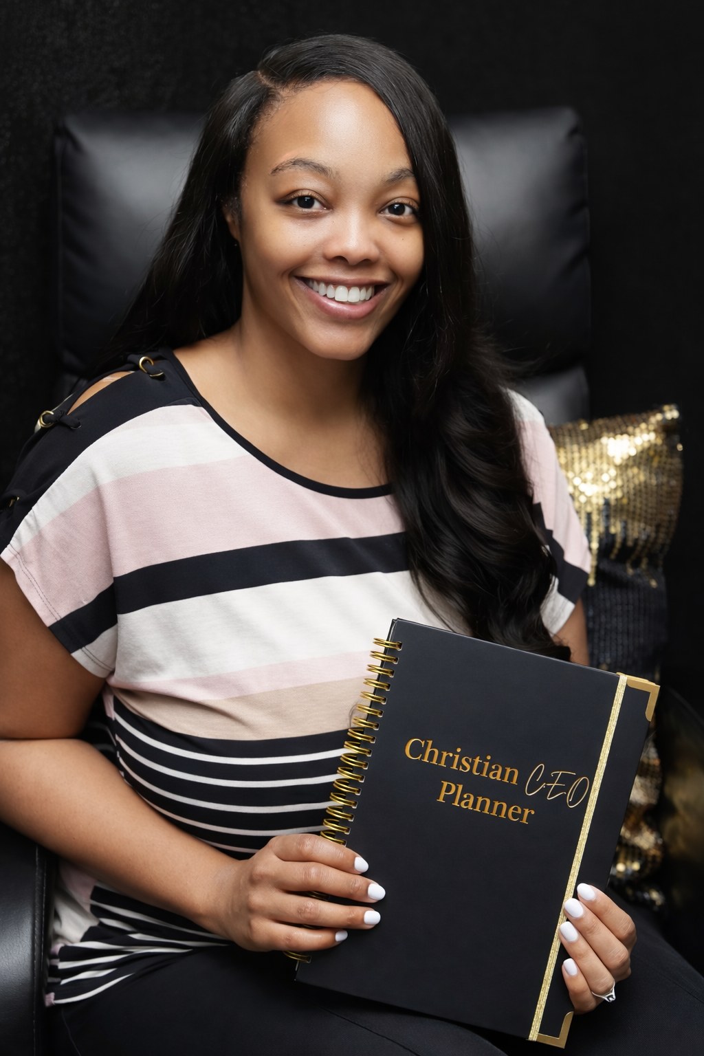 Tamara Washington holding the Christian C.E.O. Planner