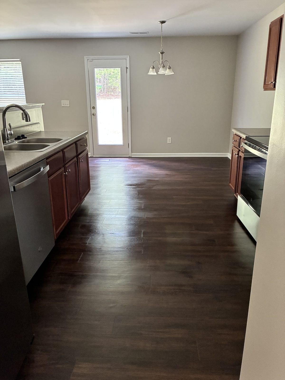 A clean kitchen and dining room prepared for daily life