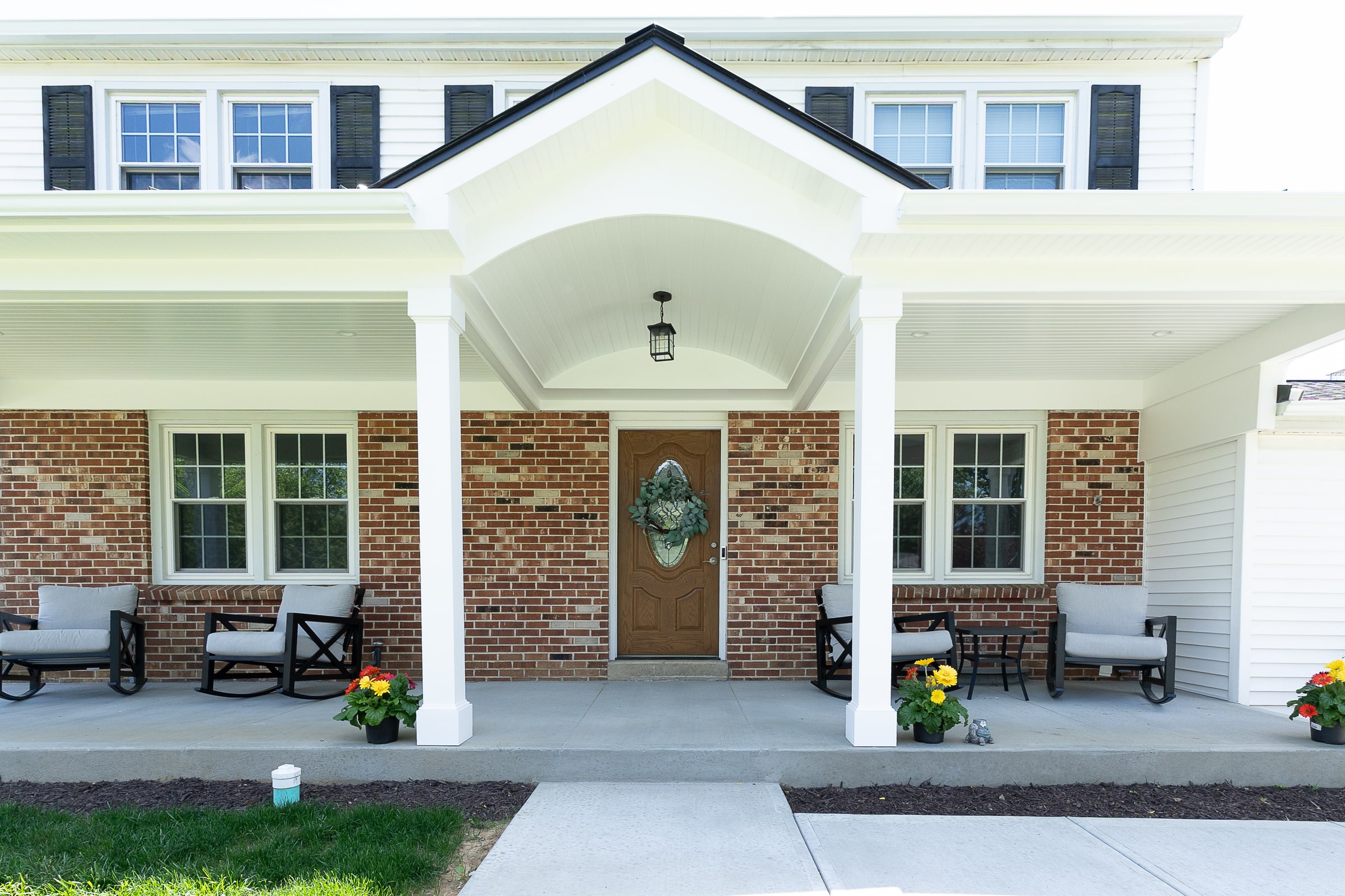 Completed front porch and exterior renovation by EMC Contracting