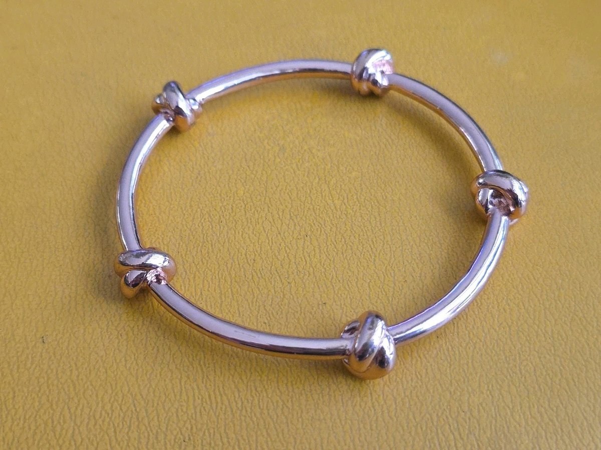 CC SKYE Love Me Knot Gold Tone Bangle Bracelet 