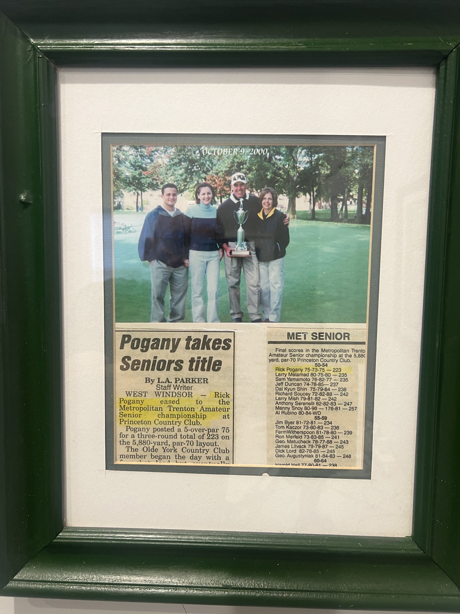 Framed October 9, 2000 newspaper clipping titled Pogany takes Seniors title