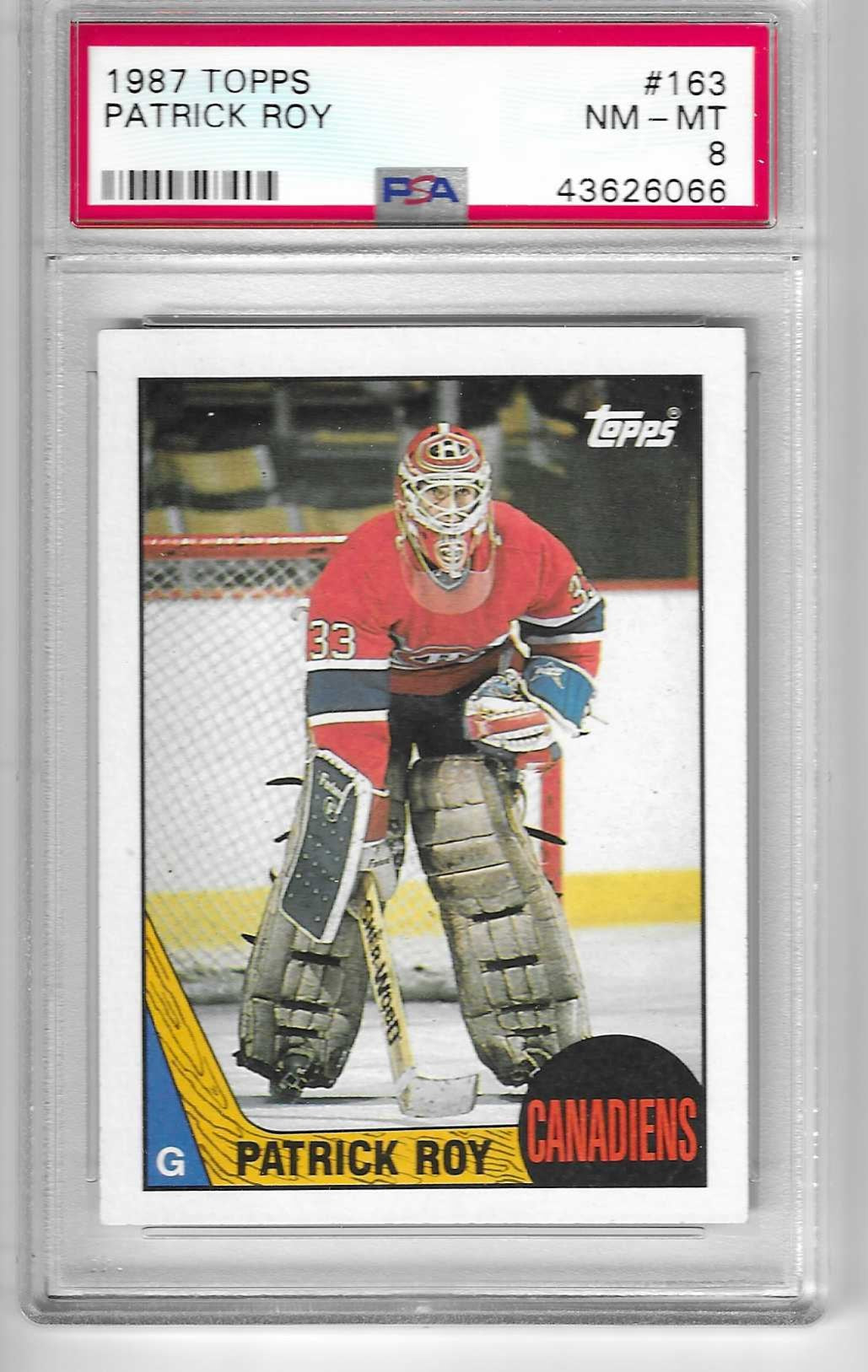 A graded Patrick Roy hockey card in a protective case
