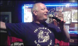 Karaoke performer singing into a microphone