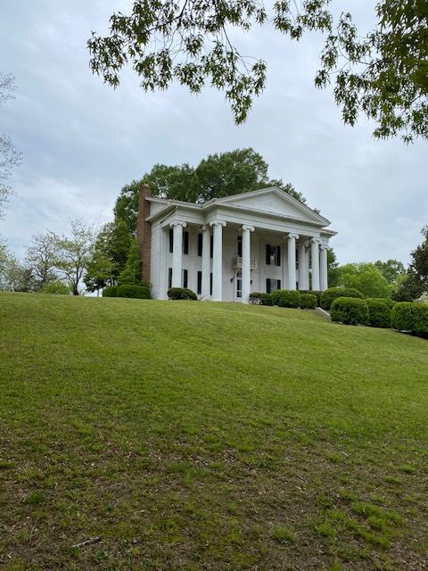 The historic house across the lawn