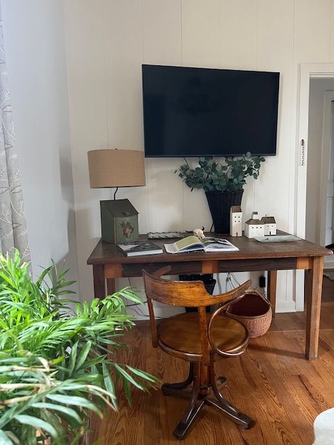 A living room with wooden chairs