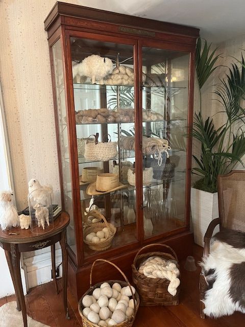 An antique cabinet and collected objects