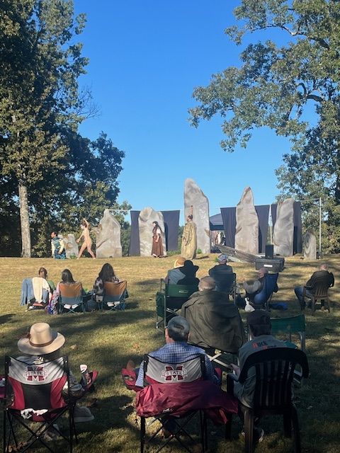 A group gathered outdoors at Woodlawn