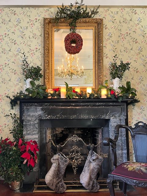 The fireplace dressed for Christmas