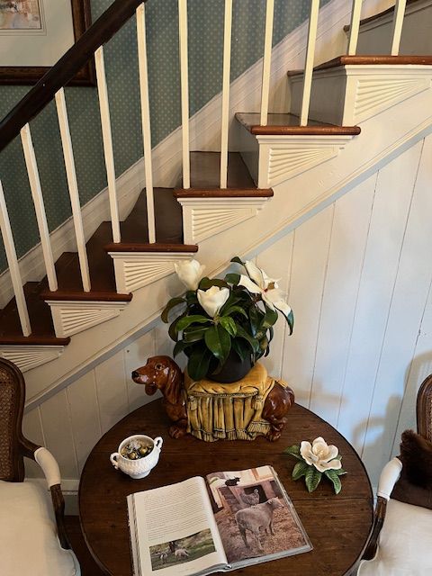 A table beside the staircase