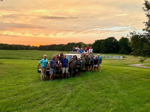A group enjoying the estate at sunset