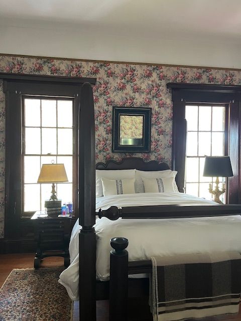An antique fireplace and mirror