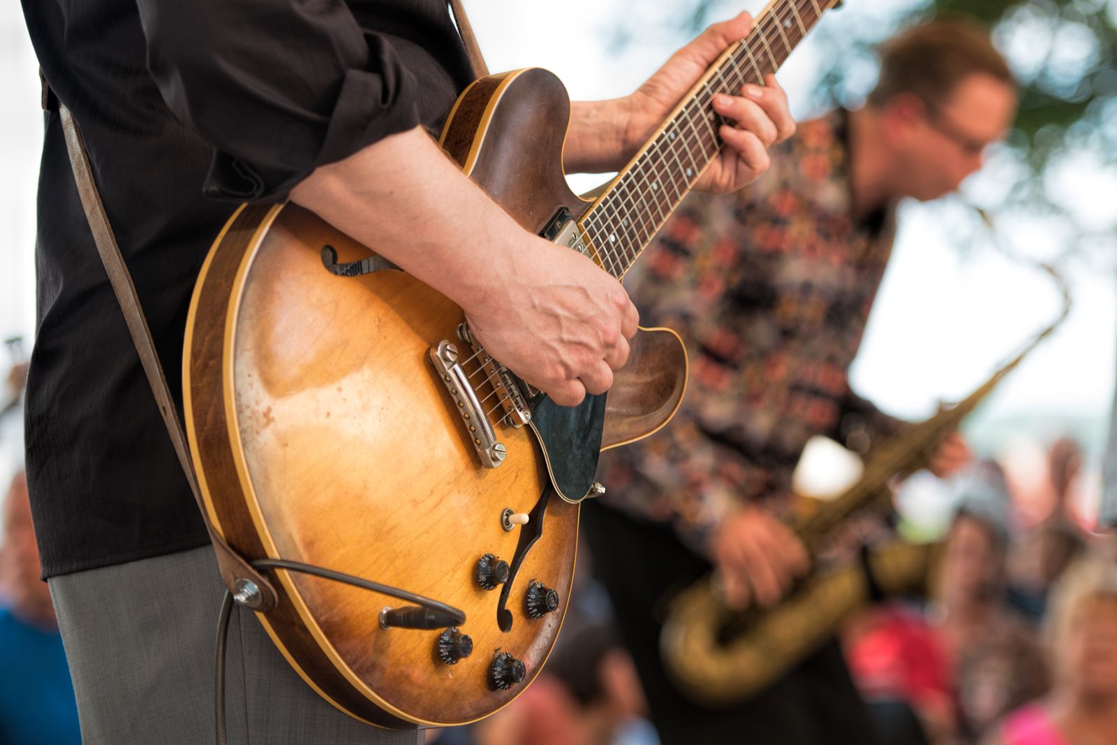 Musicians performing with guitars