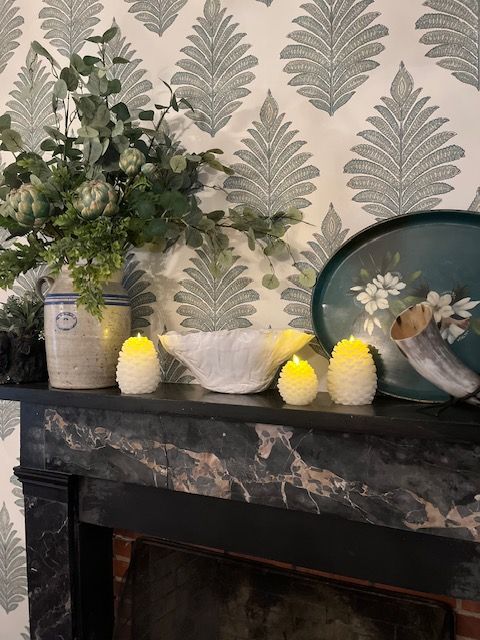 Flowers and decorative details on a mantel