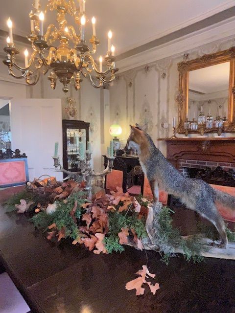 Dining room chandelier and floral centrepiece