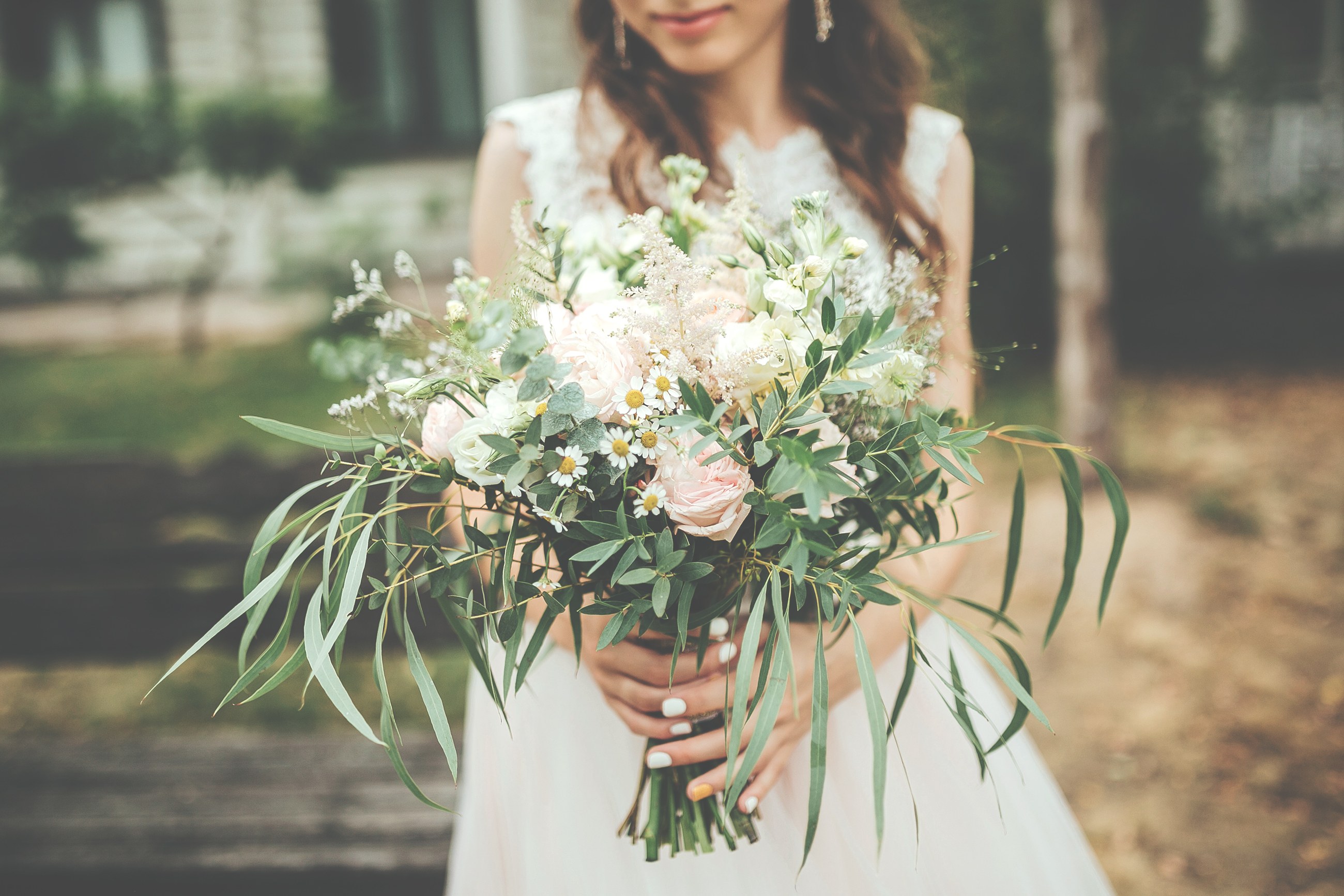 A bride holding a wedding bouquet