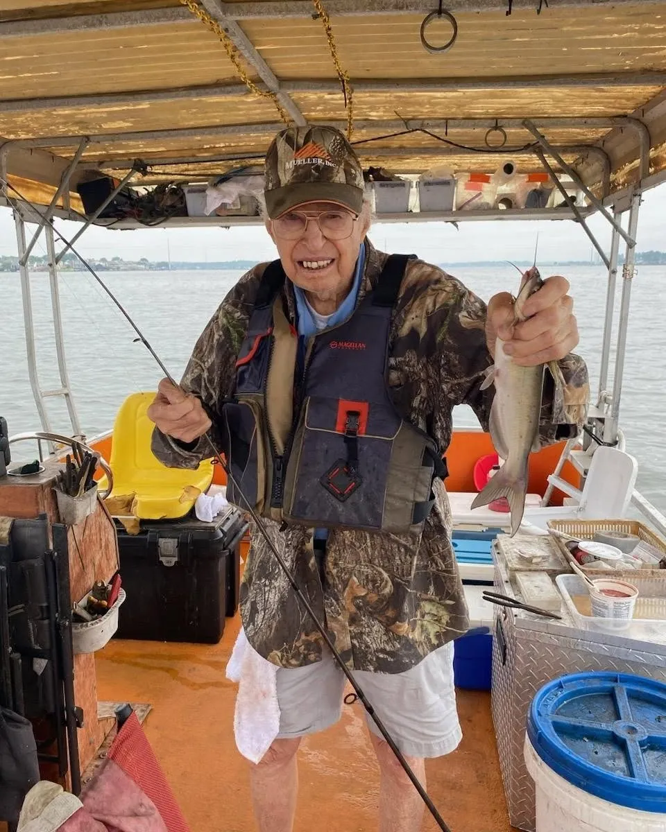 Billy Mills holding a catfish aboard his Lake Conroe fishing boat. Lake Conroe Fishing Guide - Billy Mills