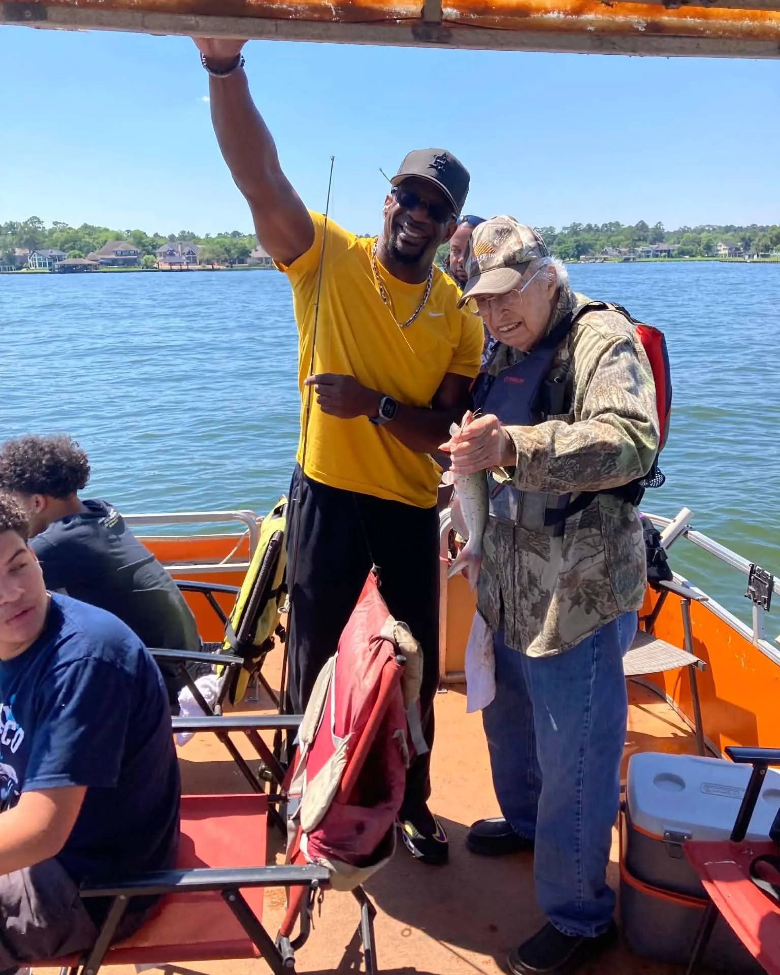 Billy standing with a guest on a Lake Conroe fishing boat. Lake Conroe Fishing Guide - Billy Mills