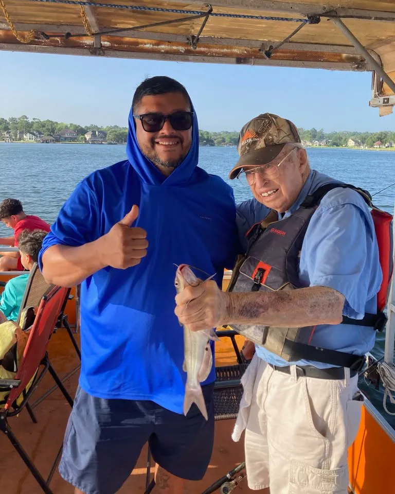 Young angler holding a crappie on a Lake Conroe fishing boat. Lake Conroe Fishing Guide - Billy Mills