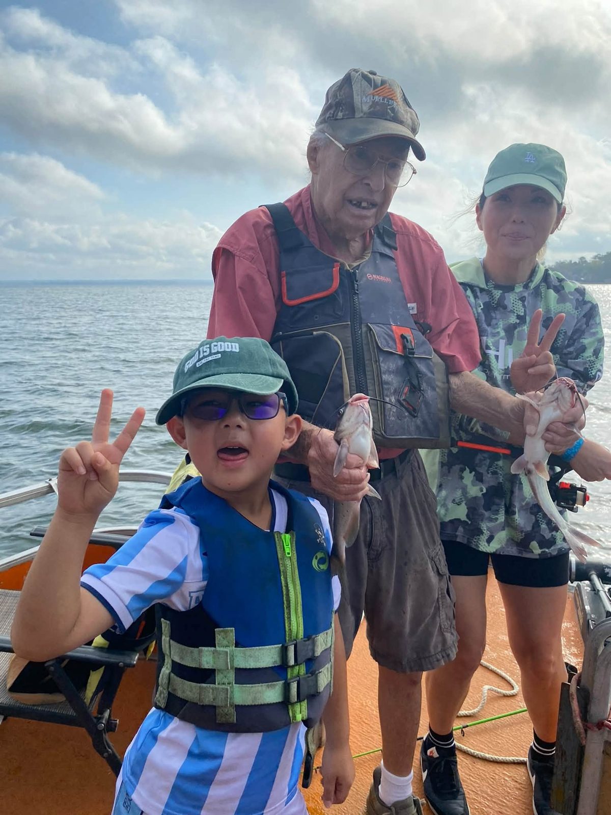 Young anglers posing with Billy and a catfish