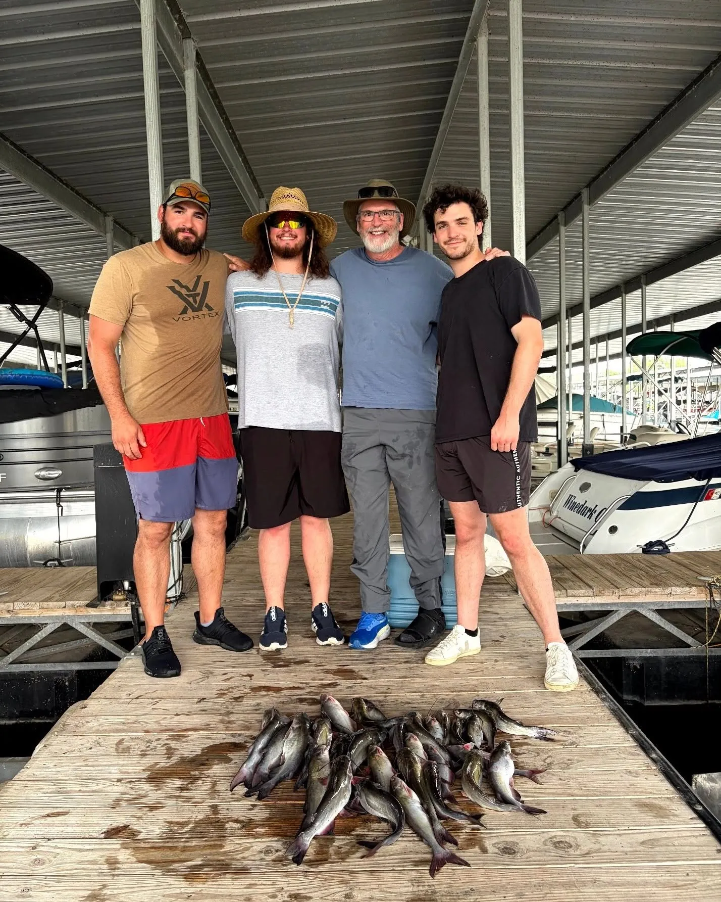 Fishing group standing beside their Lake Conroe catch at the marina. Lake Conroe Fishing Guide - Billy Mills