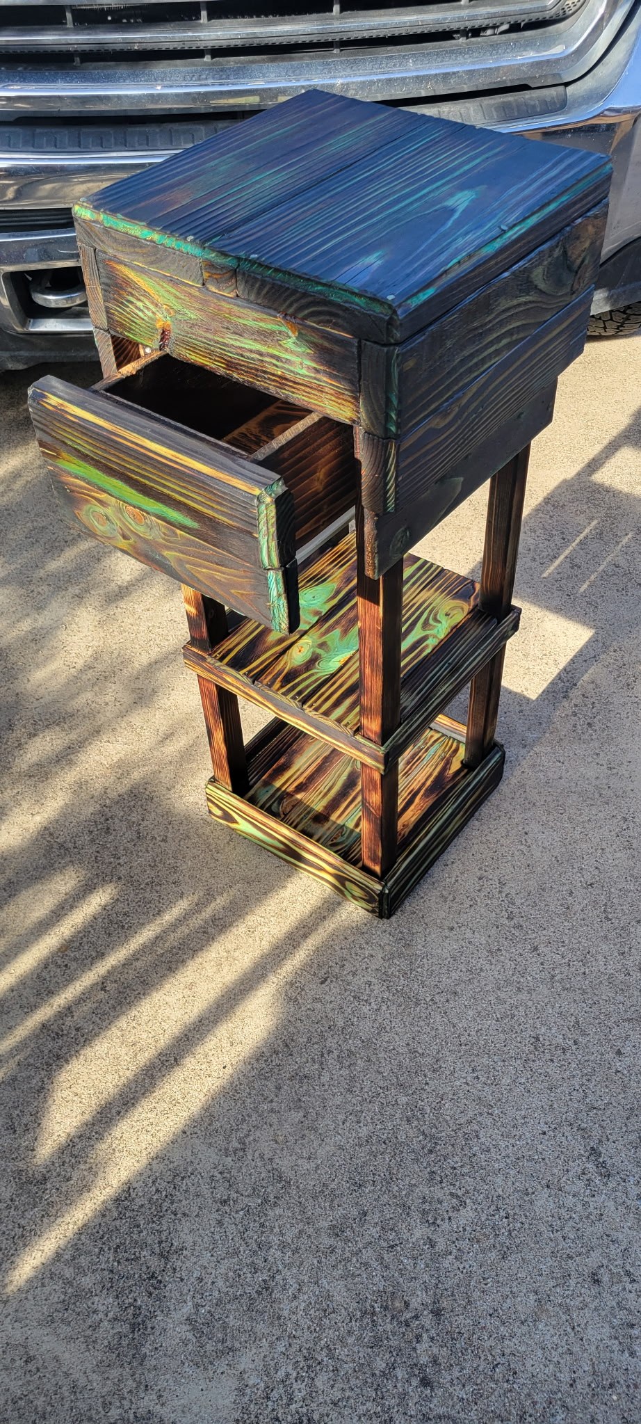Angled view of a handmade colorful wooden table