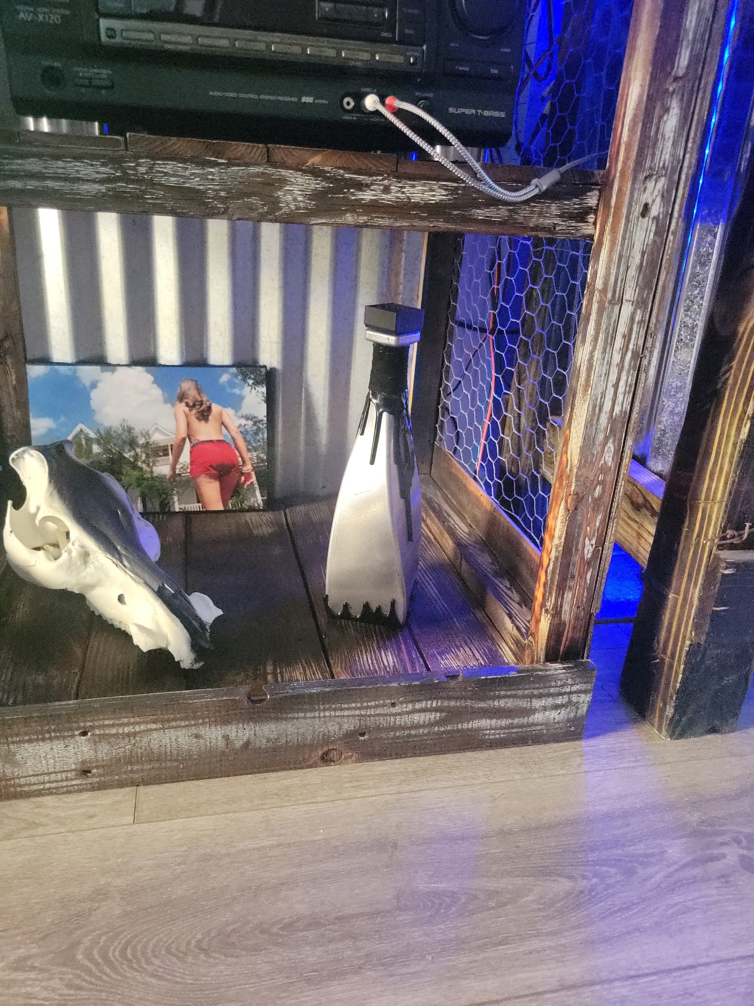 Blue-lit custom wood display cabinet