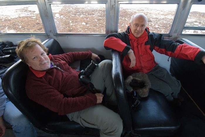 Friends for many years, Kevin Gilbert, lead Mylio Memory evangelist and Mylio's CEO and developer David Vaskevitch share dome down time on a tundra butty while photographing polar bears. 