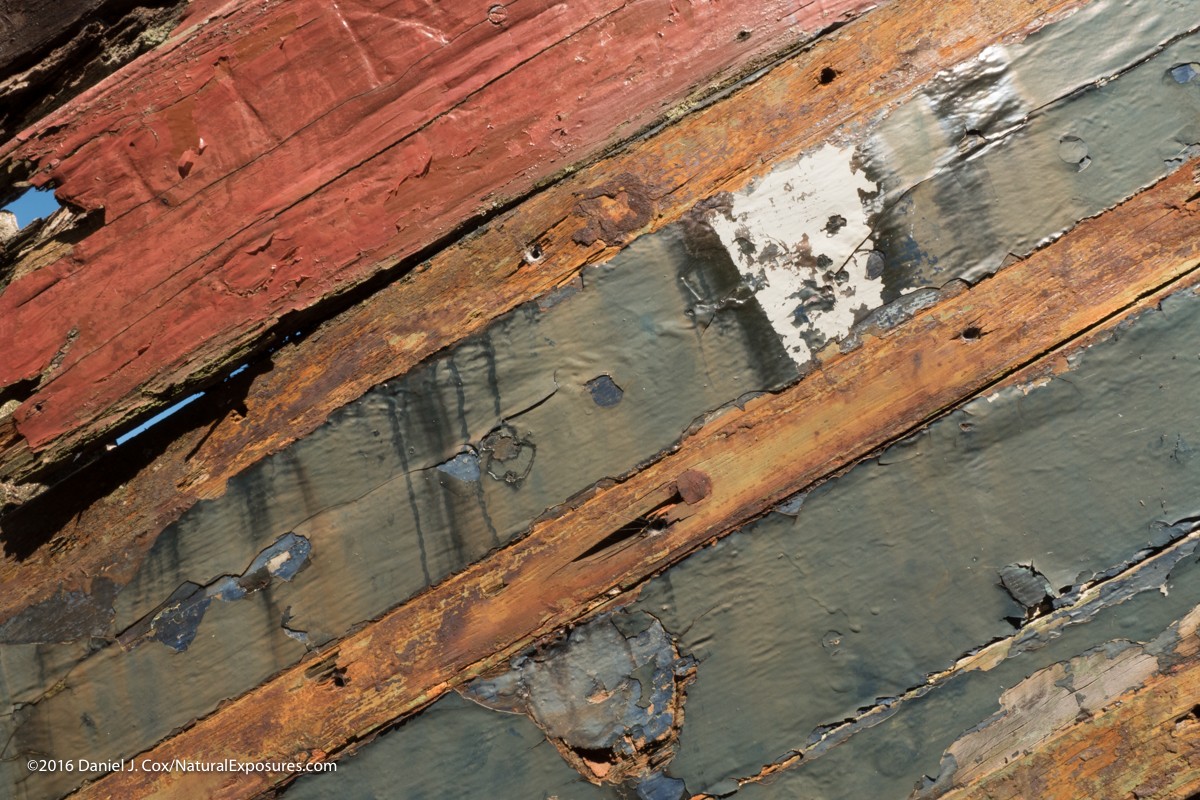 Fading colors on the hull of a depleted old boat in the Isle of Skye in Scotland. Lumix GX8 ISO 200