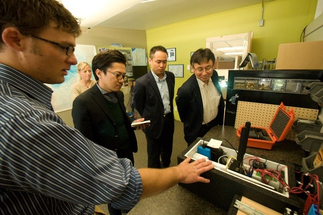 Panasonic Lumix executives checking out the remote cameras used by PBI for the maternal den study in Alaska.