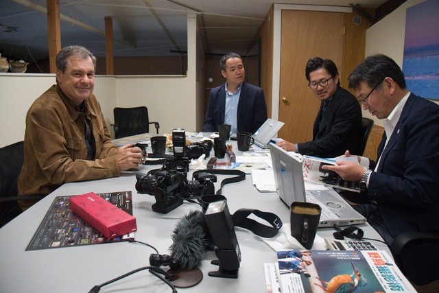Daniel Cox discusses future lens development with Panasonic Lumix executives Henri Nishikawa, Shinji Watanabe and Yasuhide Yamada at the Natural Exposures office in Bozeman, Montana