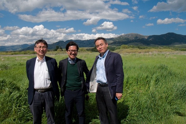 Henri Nishikawa, Shinji Watanabe and Yasuhide Yamada get their picture taken in front of the beautiful Bridger Mountains outside of Bozeman, Montana