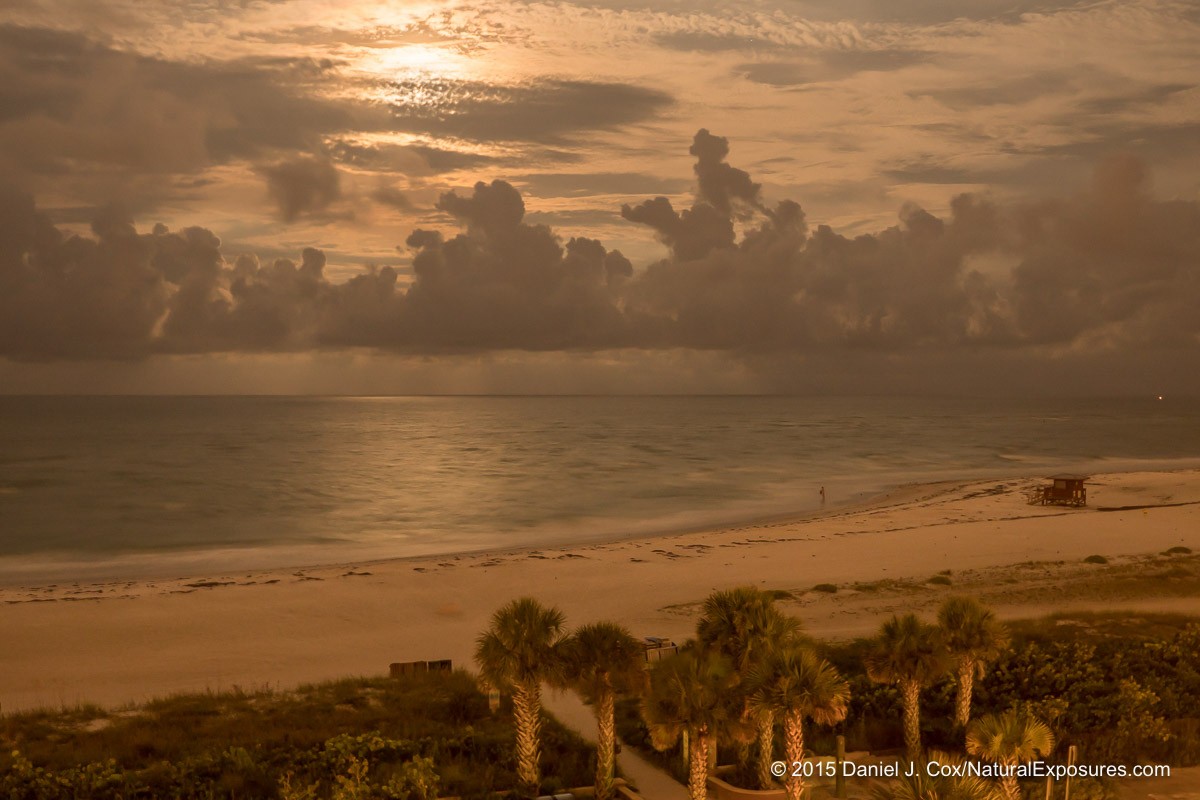 Moonrise over the Gulf of Mexico and the Sarasota Beach, Sarasota, Florida. When I shot this image I had no idea there was a person standing in the water and if you look closely it looks like it's a man and he has his swim trunks off shaking them out. I had no idea he ws even there until I processed the picture. Lumix GX8 with 12-35mm F/2.8 6 seconds at F/2.8 ISO 200