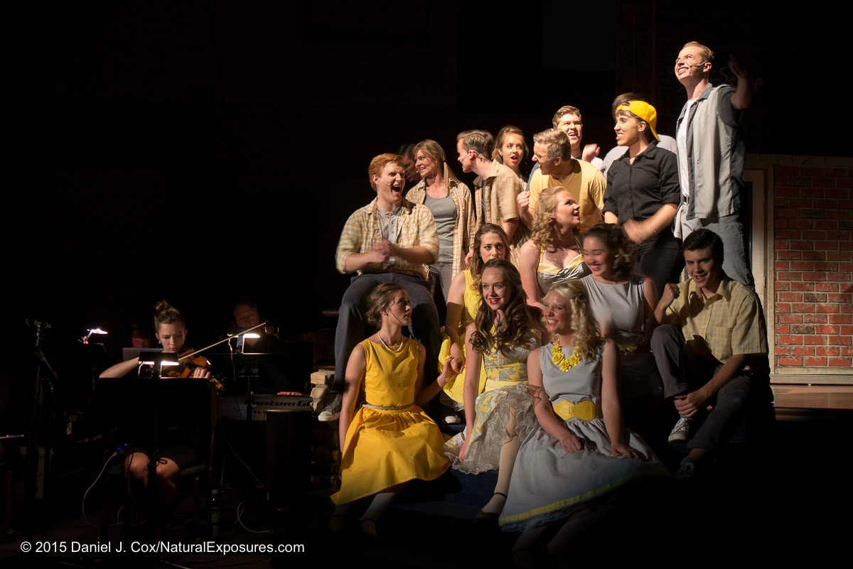 The West Side Story cast and the orchestra. Notice the young lady who moved her head. I was hand holding the camera for this image and even though it was shot at 1/25th. of a second the entire image is harp other than the movement of the you girls face due to movement. Lumix G7 with 14-140mm ISO 640