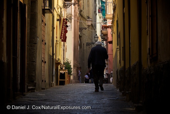 An older Italian gentleman walks the narrow streets of Sorrento, Italy