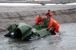 Filling the Zodiak with fresh water to resupply the ship