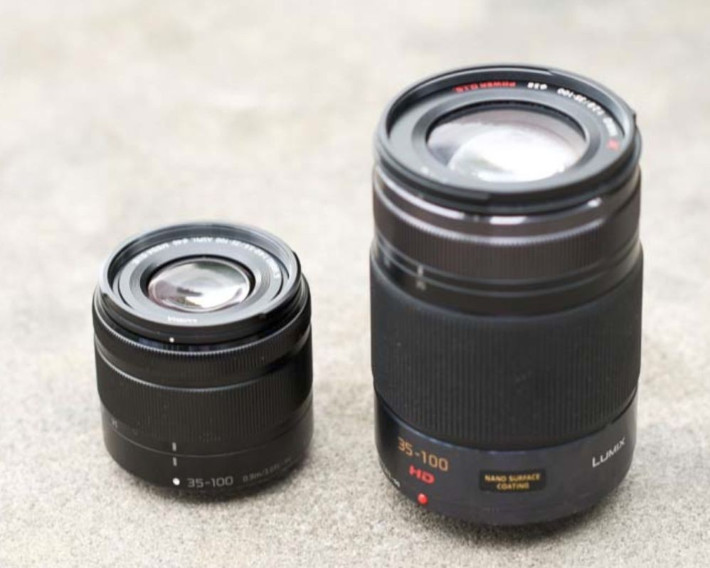 A comparison shot of the new very small Lumix 35-100mm F/4-5.6 lens with the original 35-100mm F/2.8 lens that's been round for awhile. The older 35-100mm is a professional quality optic and much faster thus the reason for it being considerably larger. 