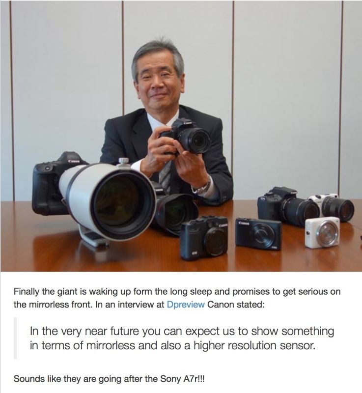 Mr. Canon has a large cup of coffee hiding just behind that large Canon lens.