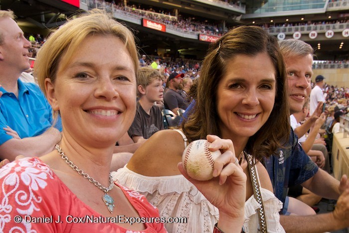 Tanya and Suzy are all smiles after a Chicago White Sox player through them a game ball. Lumix with 12-35mm. ISO 500